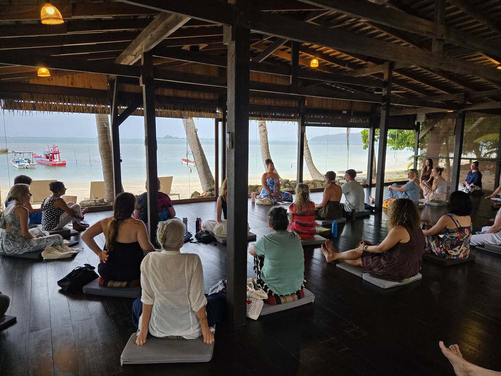 Yoga students practising in a beachfront shala at Samahita Retreat in Koh Samui